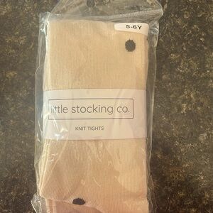 Cream with black polka dots